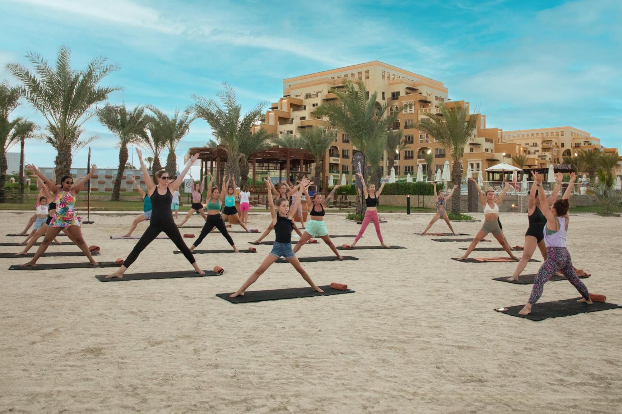 Rixos Bab Al Bahr Hotell Ras al-Khaimah Exteriör bild Yoga at the beach